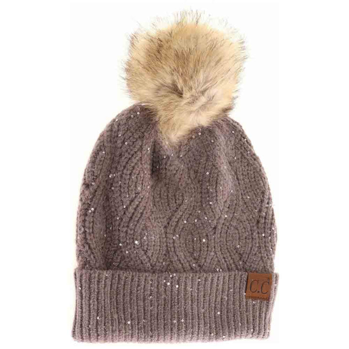 EarthGrey Sequin Brioche Cable Knit Fur Pom C.C Beanie combines classic craftsmanship with a modern touch. Featuring a soft brioche cable knit pattern enhanced by subtle sequins, this beanie adds understated sparkle to cold-weather style. The plush fur pom enhances warmth and a refined aesthetic, making it an ideal accessory for both functionality and fashion during chilly days. Durable and comfortable, it delivers expert-level design that complements any winter wardrobe. 