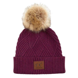 Eggplant C.C Heather Beanie Hat With Pom Pom And Suede Patch, provides excellent protection and a fashionable look with its soft heather knit material, faux fur pom pom, and stylish suede patch. The fabric is designed to keep you comfortably warm in cold weather. Add this fashionable accessory to the winter wardrobe collection.