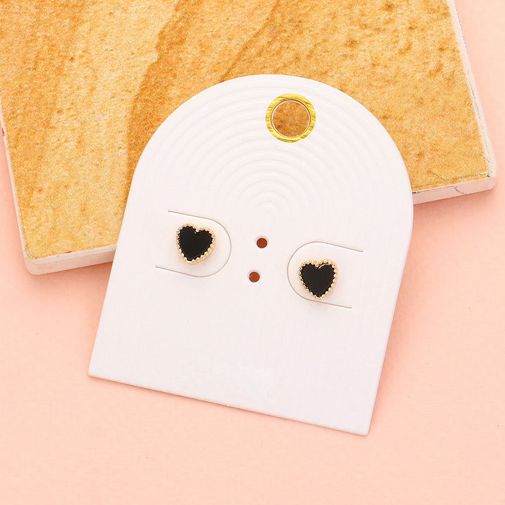 Enamel Heart Stud Earrings add a pop of color to any outfit. Crafted with durable enamel and a classic stud design, these earrings are perfect for everyday wear. Complete your look and make a statement with these versatile and stylish earrings.