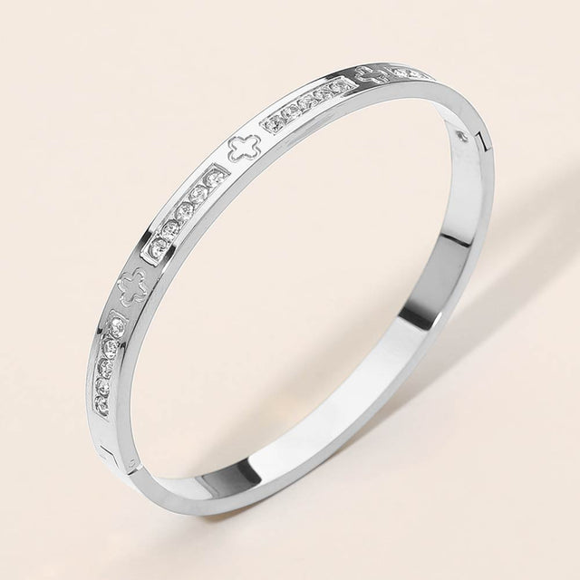 Madeline Love Silver Stainless Steel CZ Accent Quatrefoil Engraved Hinged Bangle Bracelet - Bracelets