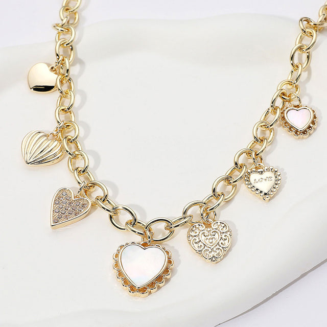 Madeline Love Gold 14K Gold Plated CZ Stone Paved Mother of Pearl Heart Charm Station Necklace