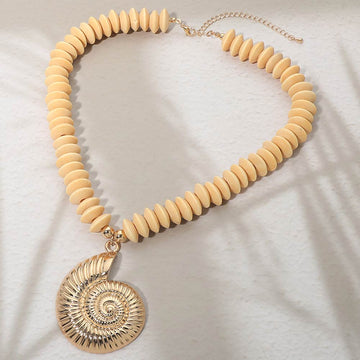 Madeline Love Ivory, Worn Gold Spiral Shell Accent Wooden Beaded Statement Necklace - Necklaces