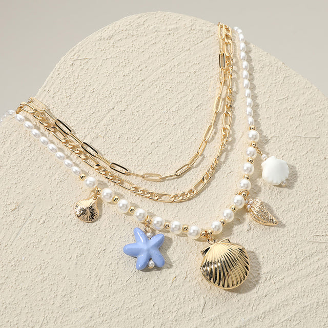 Gold, Multi Metal Sea Shell Locket Pendant Puka Shell Ceramic Starfish Charm Station Pearl Paperclip Chain Layered Necklace