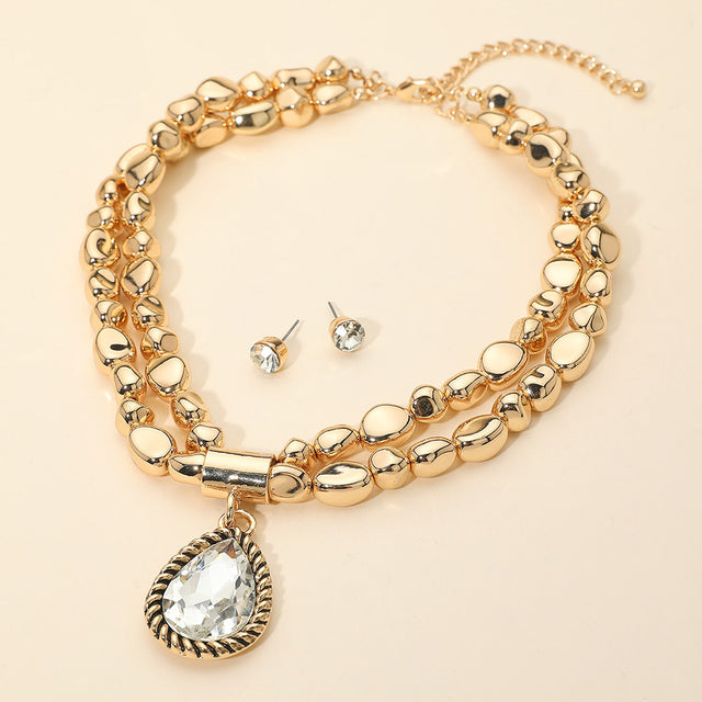 Madeline Love Clear, Gold Bold Teardrop Pendant Metal Pebble Beaded Double Layered Statement Necklace
