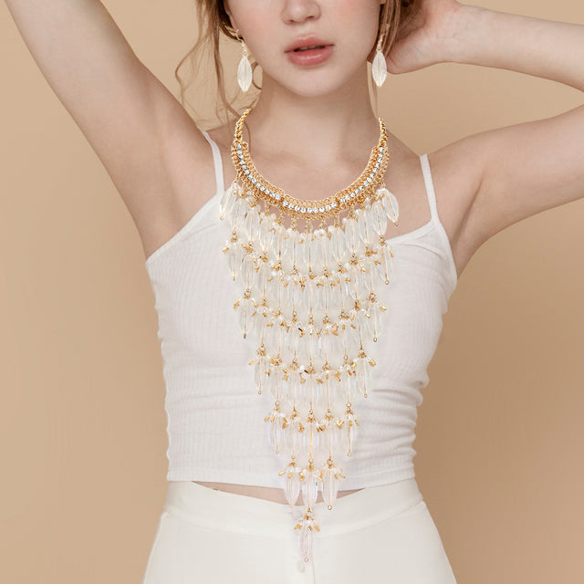 Madeline Love Clear, Gold, Lucite Lucite Stone Embellished Bib Necklace - Necklaces
