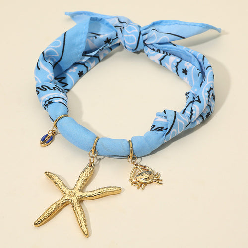 Textured Metal Starfish Conch Shell Crab Charm Nautical Print Fabric Wrap Statement Necklace - Blue, Gold