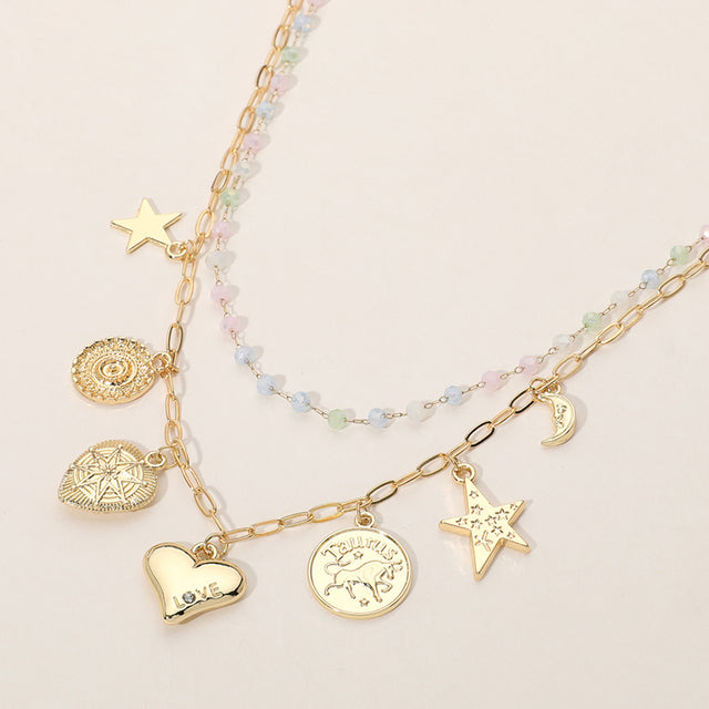 Madeline Love Gold, Multi Metal Zodiac Taurus Medal Star Heart Crescent Charm Station Faceted Beads Station Layered Necklace