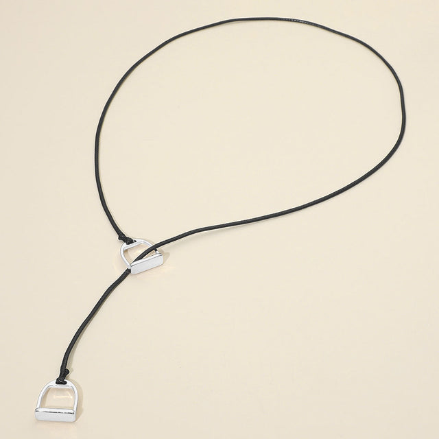 Madeline Love Black, Rhodium Metal Horsebit Lariat Waxed Cord Necklace - Necklaces