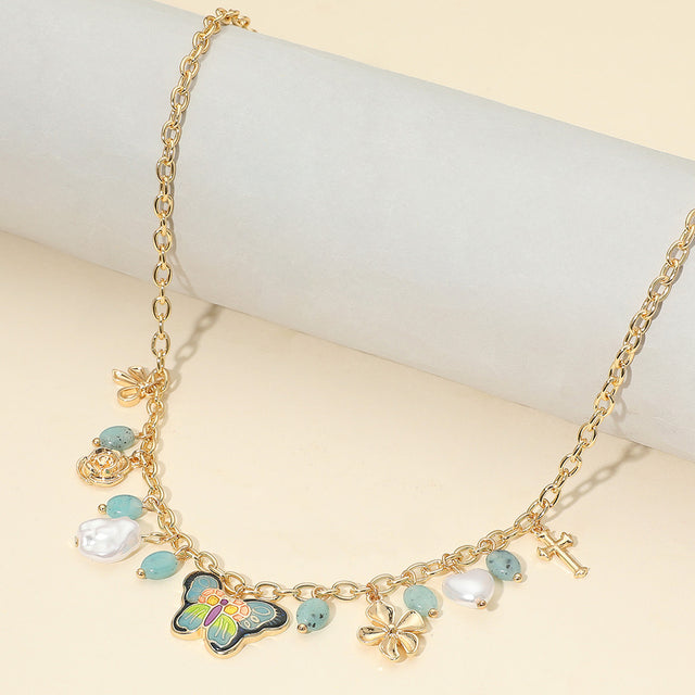 Madeline Love Gold, Navy Enamel Butterfly Flower Cross Bow Heart Pearl Charm Station Necklace - Necklaces