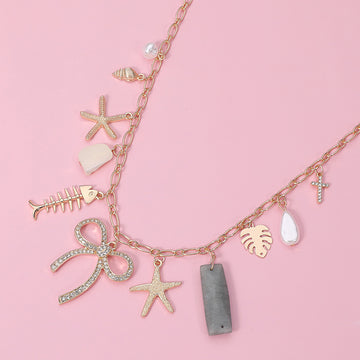 Madeline Love Clear, Gold Stone Paved Bow Metal Starfish Fish Shell Pearl Tropical Leaf Charm Station Necklace - Necklaces