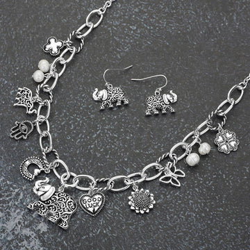 Madeline Love Antique Silver Antique Metal Elephant Hamsa Hand Clover Quatrefoil Butterfly Good Luck Heart Pearl Charm Station Necklace - Necklaces