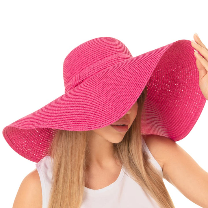 FUCHSIA Solid Floppy Straw Sun Hat, Stay stylish and protected from the sun with our sun hats! Made from high-quality straw, this hat is perfect for any sunny day. Its floppy design not only looks fashionable but also provides ample shade for your face and neck. Don't forget to pack this accessory for your next beach trip!