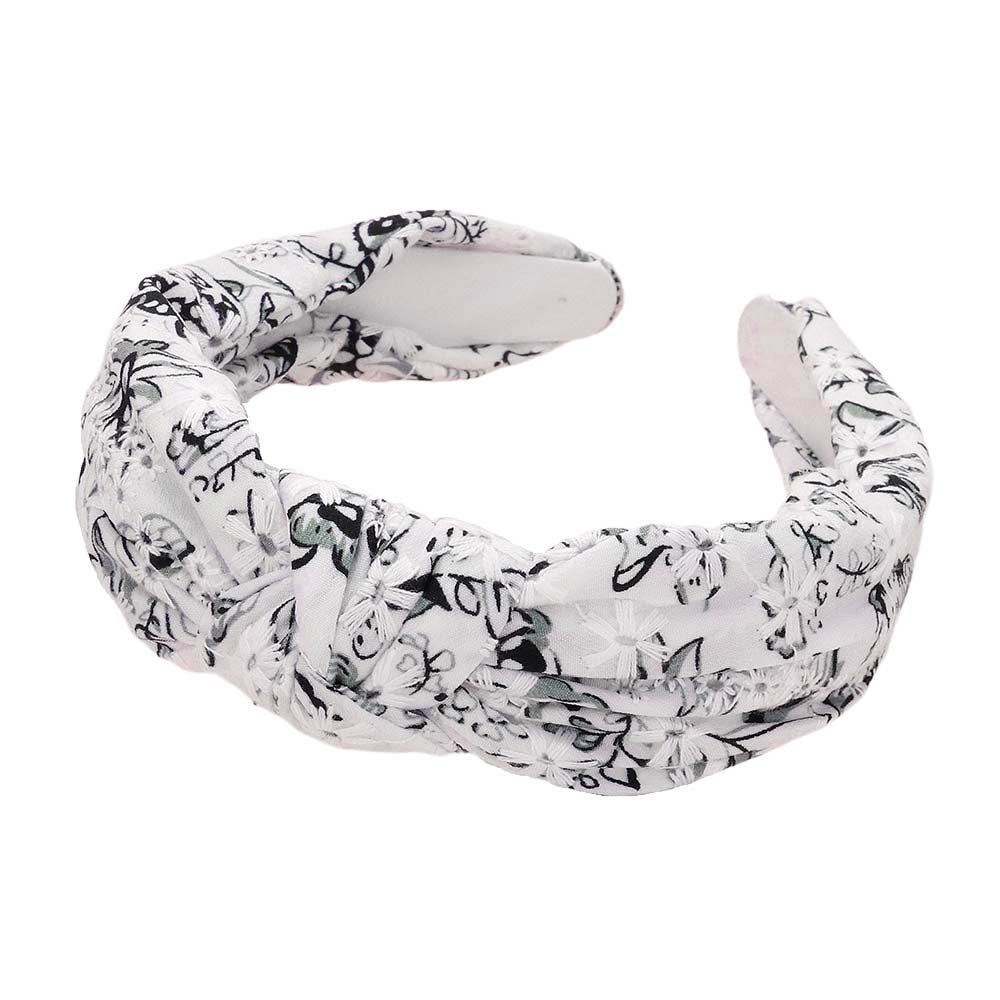 Black_White Flower Printed Knot Headband. The vibrant floral design adds a touch of femininity to any outfit, while the knot detail ensures a comfortable and secure fit. Made with high-quality materials, this headband is both stylish and practical for any occasion. Perfect gift for young adults, and fashion-loving individuals.