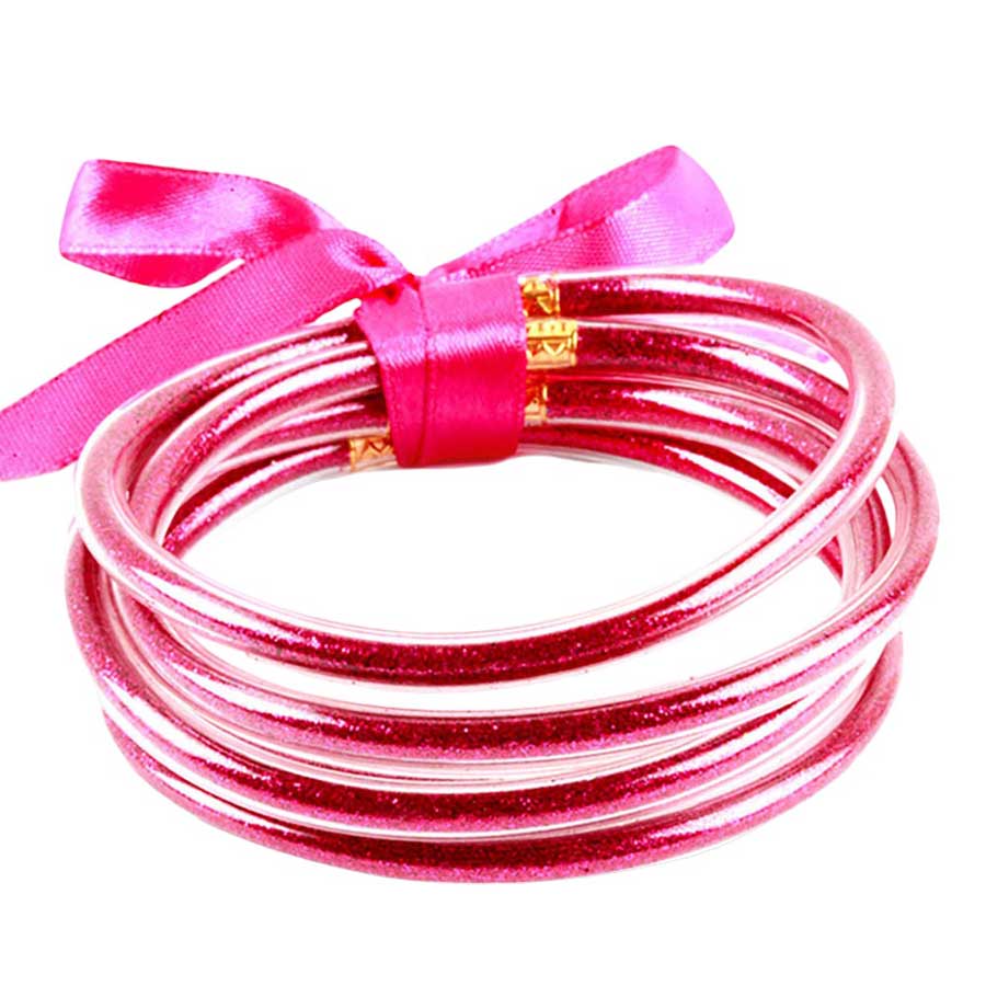 Fuchsia 5PCS Glitter Jelly Tube Bangle Bracelets, these 5 colorful, glittered bracelets are perfect for adding a fashionable yet eye-catching touch to any outfit. Made from jelly tubes and shimmering glitter, they are durable and comfortable to wear. Add a pop of color and sparkle to your wardrobe with these stylish bracelets.