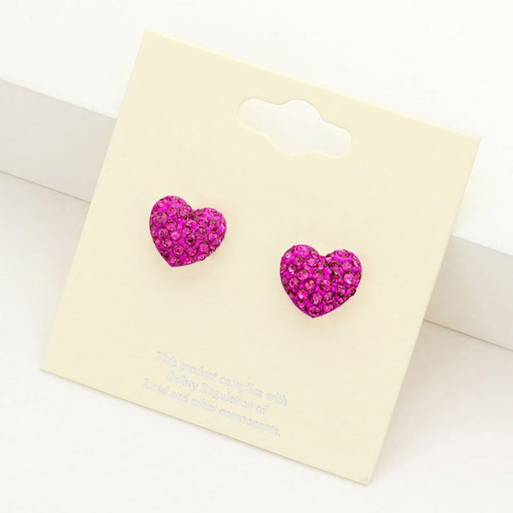 Fuchsia Crystal Pave Heart Stud Earrings add elegance to any outfit. The sparkling pave design is crafted precisely, and the heart shape symbolizes love and affection, making them the perfect accessory for any special occasion.