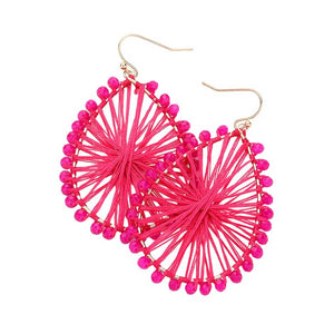 Fuchsia Faceted Beaded Thread Wrapped Open Teardrop Dangle Earrings, Expertly crafted with faceted beads and wrapped in thread, these open teardrop dangle earrings are a stunning addition to any outfit. The unique design and high-quality materials make for a luxurious and eye-catching piece. Elevate your style with these.