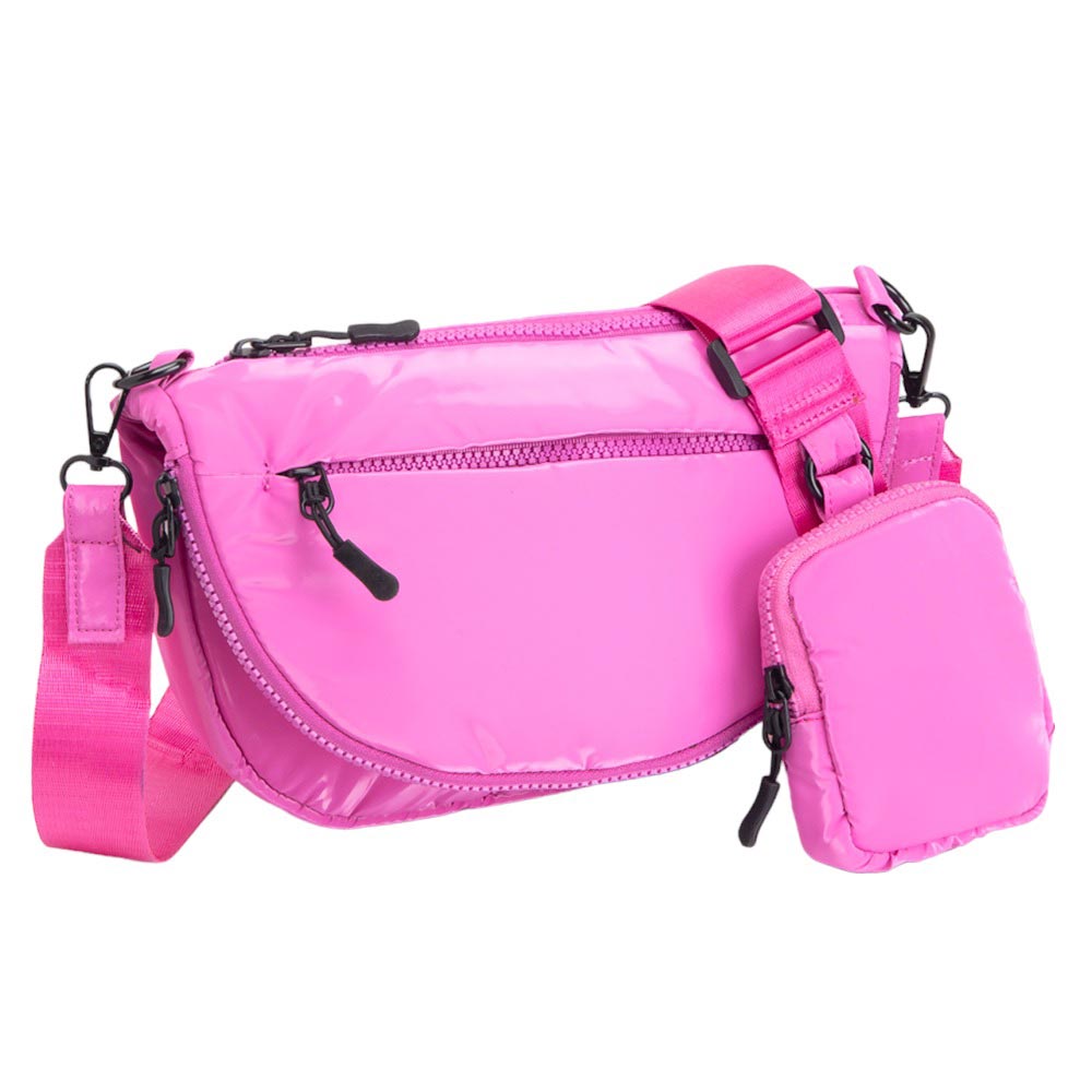 Fuchsia Glossy Puffer Half Moon Crossbody Bag, the lightweight, stylish design features a durable water-resistant nylon that is perfect for outdoor activities. The adjustable shoulder strap makes it easy to sling across your body for hands-free convenience. Carry your essentials in style and comfort with this fashionable bag.