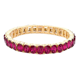 Fuchsia Oval Stone Cluster Stretch Evening Bracelet, an exquisite piece of jewelry with beautiful oval-shaped stones arranged in a cluster. Crafted with a stretchable elastic band, this bracelet provides a comfortable fit for any size wrist. A stunning accessory for a special occasion. Perfect gift choice for someone you love.