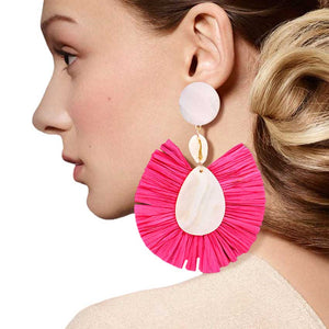 Fuchsia Puka Shell Mother of Pearl Teardrop Raffia Trimmed Earrings, adorn yourself with these teardrop raffia trimmed earrings! puka shell mother-of-pearl teardrop earrings go perfectly with a t-shirt, summer dress or work clothes, beach party, and many more. 