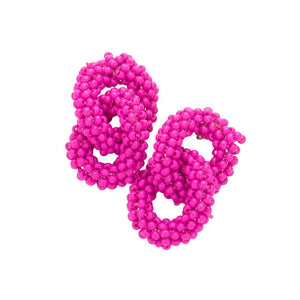 Fuchsia Seed Beaded Double Open Circle Link Dangle Earrings, are a unique and stylish accessory that will add a visual effect to any outfit. The seed beads form feather-light circles that are linked together with a drop dangle design. Perfect for any occasion or everyday wear. Smart gift choice for friends and family members.