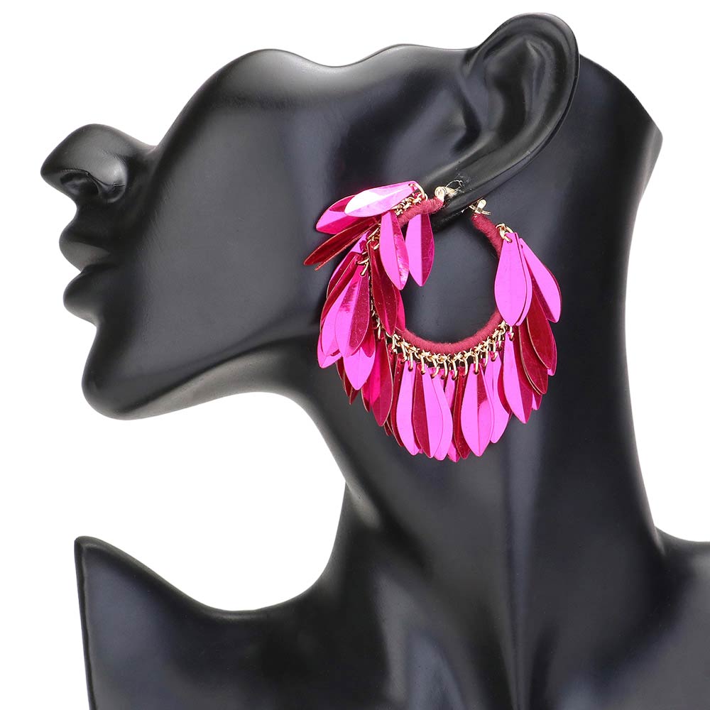 Fuchsia Sequin Fringe Hoop Pin Catch Earrings add a touch of glamour to any outfit. The hoop design features cascading sequins for a chic and trendy look. The pin catch style ensures they will stay securely in place, making them perfect for a night out or special occasion. Ideal gift for any fashion forward individual.