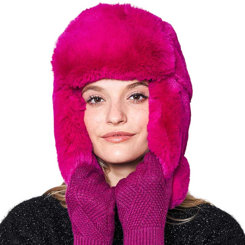 Fuchsia Solid Faux Fur Trapper Hat, is perfect for winter outdoor adventures. Crafted from soft faux fur, the hat will comfortably protect your head from the cold while looking stylish. With its windproof design, this hat is a must-have for winter weather. Ideal gift for your friends and family members on colder days.