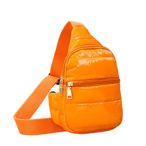 Glossy Orange Solid Puffer Mini Sling Bag, be the ultimate fashionista while carrying this Solid Puffer Sling bag in style. It's great for carrying small and handy things. Keep your keys handy & ready for opening doors as soon as you arrive. The adjustable lightweight features room to carry what you need for long walks or trips. 