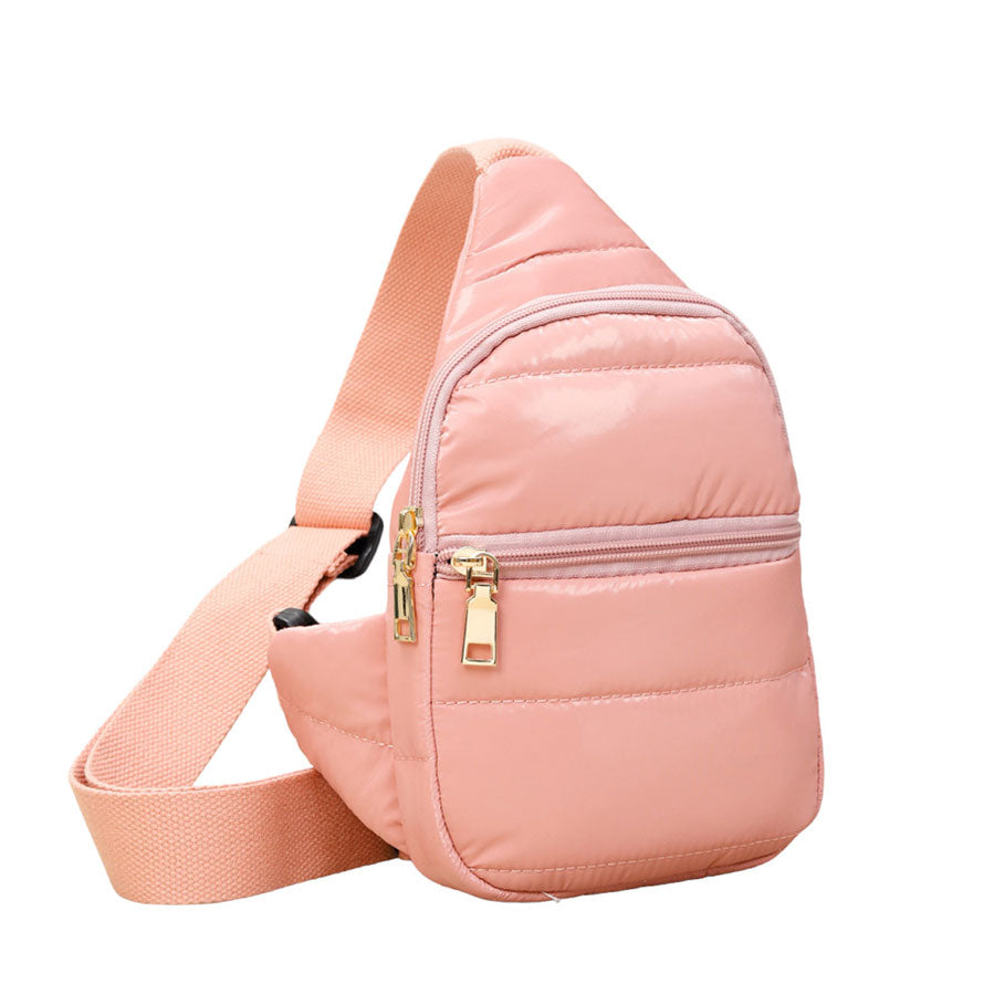 Glossy Pink Solid Puffer Mini Sling Bag, be the ultimate fashionista while carrying this Solid Puffer Sling bag in style. It's great for carrying small and handy things. Keep your keys handy & ready for opening doors as soon as you arrive. The adjustable lightweight features room to carry what you need for long walks or trips.