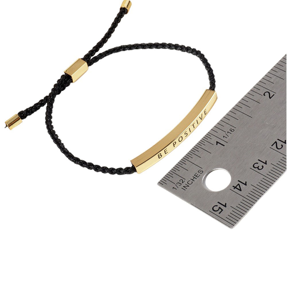 Gold-Dipped LIVE LAUGH LOVE Message Bar Pointed Rope Adjustable Cinch Pull Tie Bracelet, adjustable design allows for a perfect fit while the message of positivity adds a touch of motivation to any outfit. Made from quality materials, this bracelet is a stylish reminder to live, laugh, and love.