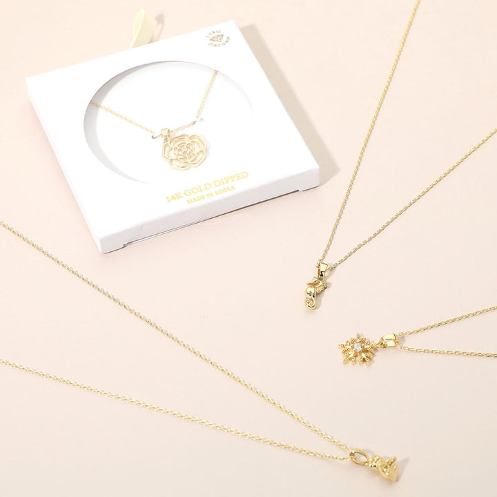 Celebrate the season with this festive bell pendant necklace, beautifully detailed with shimmering accents and a charming bow design. Perfect for holiday wear or as a thoughtful gift, this elegant piece adds timeless sparkle and cheerful style to any jewelry collection.