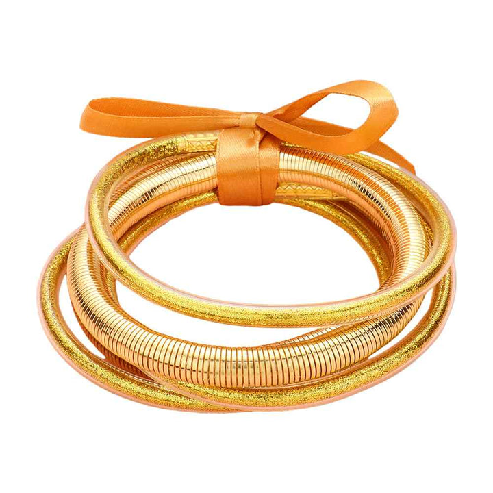 Gold 5PCS Glitter Jelly Tube Metal Elastic Layered Bracelets made with high-quality materials. The elastic design ensures a comfortable fit for all wrist sizes. 