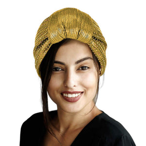 Gold Bling Turban Hat, this stylish hat is sure to turn heads. Crafted using premium materials, the hat features a modern design with sparkling sequins to create an eye-catching look. Perfect for special occasions, this hat is sure to add a touch of glamour to any outfit. Fashionable winter gift idea.
