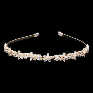 Gold CZ Flower Cluster Headband features sparkling CZ flowers that add a touch of elegance to any hairstyle. The headband is perfect for weddings, parties, or any special occasion. Crafted with meticulous attention to detail, this headband is sure to make a statement. Elevate your look with the CZ Flower Cluster Headband.