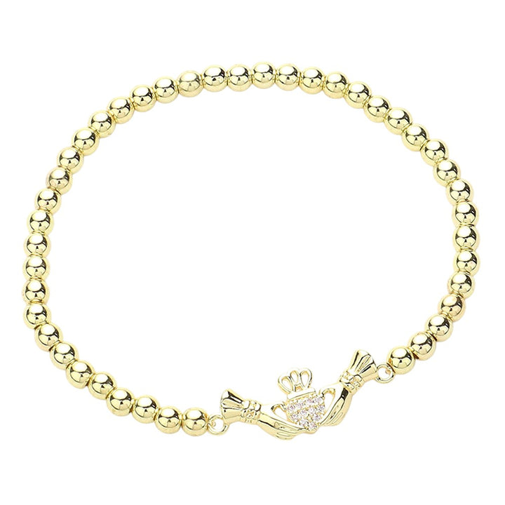 Gold CZ Stone Paved Irish Claddagh Stainless Steel Ball Stretch Bracelet is a stunning accessory that combines a traditional Irish symbol with a modern design. The pave CZ stones add a touch of elegance, while the stretch bracelet makes it comfortable to wear. Made from durable stainless steel, it is perfect for everyday wear.
