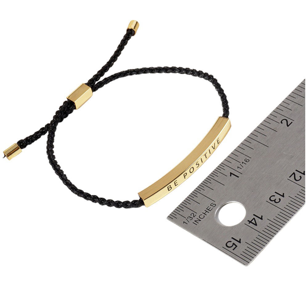 Gold-Dipped BELIEVE Message Bar Pointed Rope Adjustable Cinch Pull Tie Bracelet features an adjustable cinch pull tie for a perfect fit. The "BELIEVE" message bar adds a touch of inspiration to any outfit. Made with durable rope, this bracelet is designed to last and elevate your style.