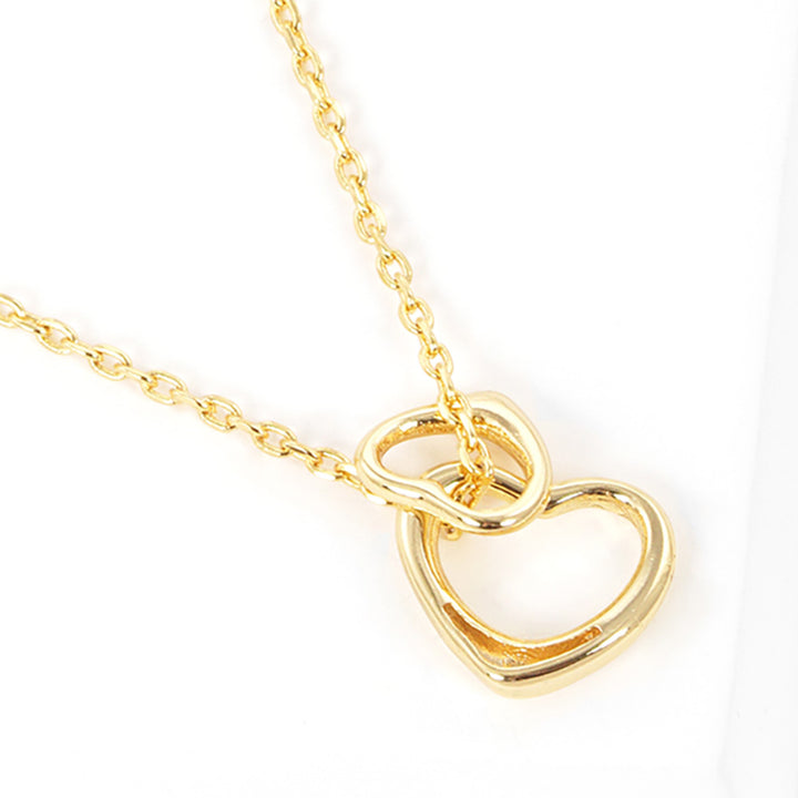 Gold-Dipped Double Heart Pendant Necklace is a chic and timeless accessory that elevates any wardrobe. Crafted from high-quality materials, this necklace features a delicate yet durable design, making it ideal for both everyday wear and special occasions. The gold-dipped double-heart pendant symbolizes love and adds an elegant touch to any outfit.