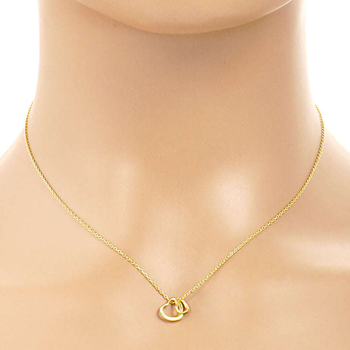 Gold-Dipped Double Heart Pendant Necklace is a chic and timeless accessory that elevates any wardrobe. Crafted from high-quality materials, this necklace features a delicate yet durable design, making it ideal for both everyday wear and special occasions. The gold-dipped double-heart pendant symbolizes love and adds an elegant touch to any outfit.