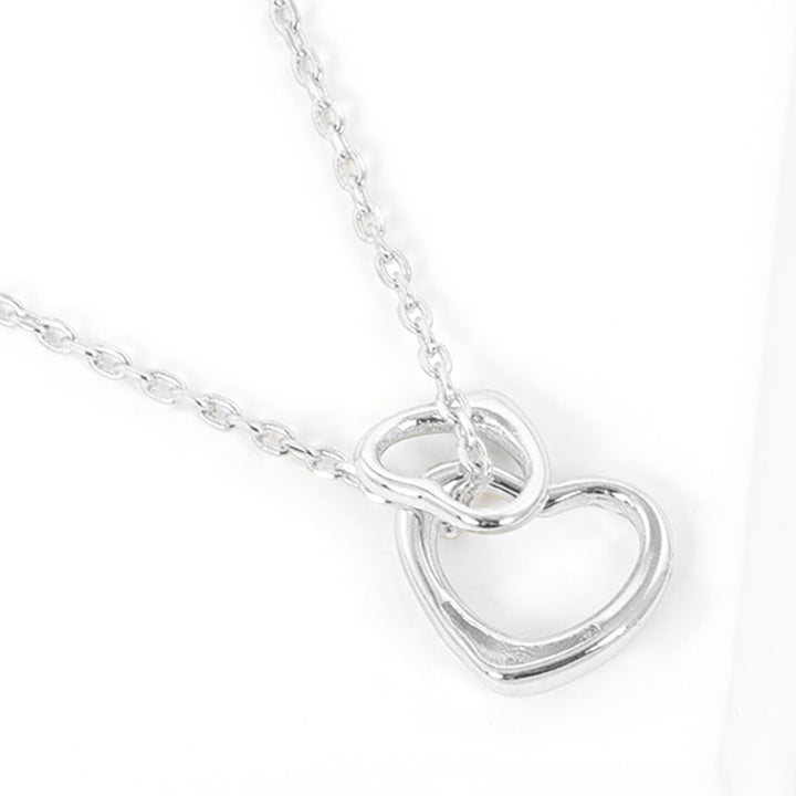 Gold-Dipped Double Heart Pendant Necklace is a chic and timeless accessory that elevates any wardrobe. Crafted from high-quality materials, this necklace features a delicate yet durable design, making it ideal for both everyday wear and special occasions. The gold-dipped double-heart pendant symbolizes love and adds an elegant touch to any outfit.