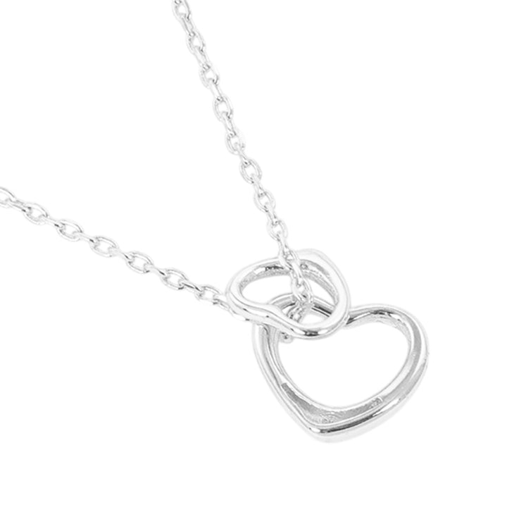 Gold-Dipped Double Heart Pendant Necklace is a chic and timeless accessory that elevates any wardrobe. Crafted from high-quality materials, this necklace features a delicate yet durable design, making it ideal for both everyday wear and special occasions. The gold-dipped double-heart pendant symbolizes love and adds an elegant touch to any outfit.