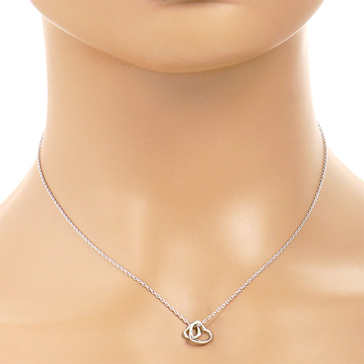 Gold-Dipped Double Heart Pendant Necklace is a chic and timeless accessory that elevates any wardrobe. Crafted from high-quality materials, this necklace features a delicate yet durable design, making it ideal for both everyday wear and special occasions. The gold-dipped double-heart pendant symbolizes love and adds an elegant touch to any outfit.