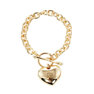 Gold Gold Dipped Metal Heart Charm Toggle Bracelet adds a touch of sophistication to any outfit. Made with high-quality materials, it features a delicate heart charm and a easy-to-use toggle closure. Upgrade your jewelry collection with this timeless piece. 