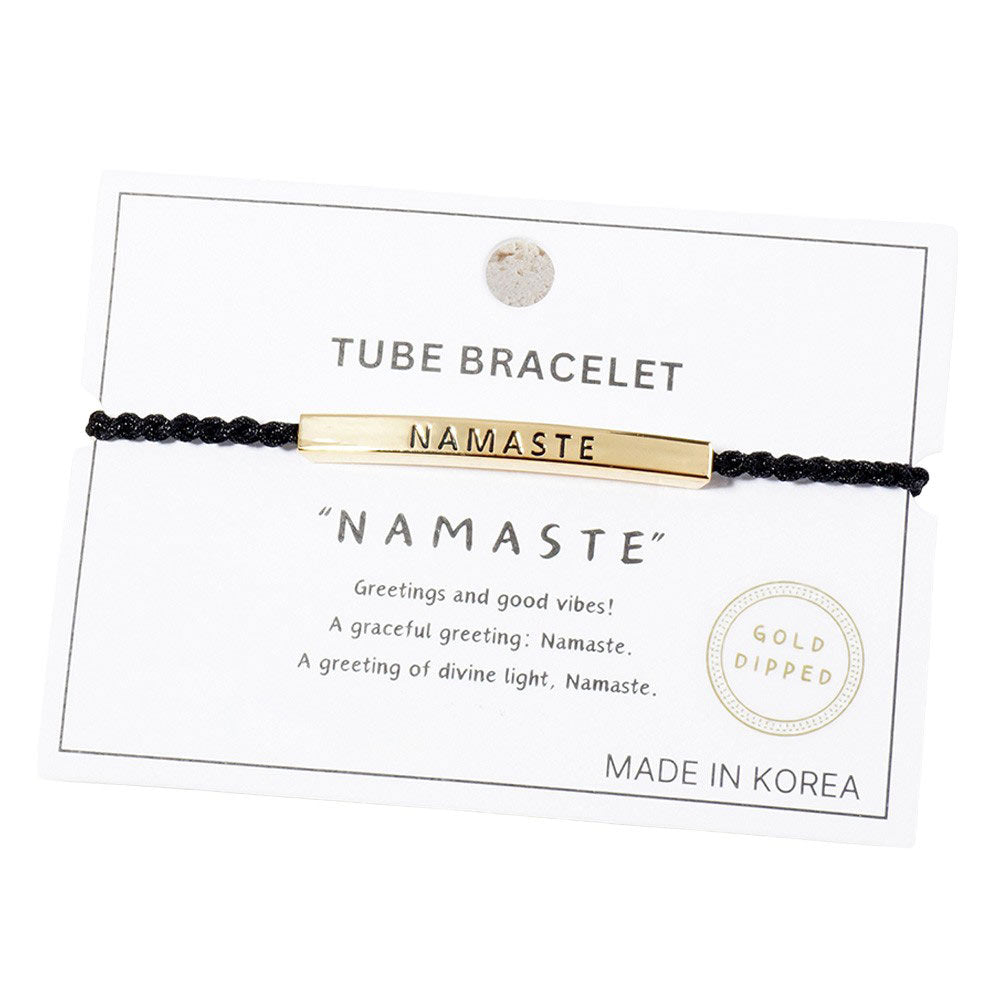 Gold-Dipped NAMASTE Message Bar Pointed Rope Bracelet is a versatile and stylish addition to any outfit. The dipped finish adds a touch of elegance, while the adjustable rope design allows for a perfect fit. Show off your spiritual side with the NAMASTE message bar, a reminder to always stay centered and at peace 