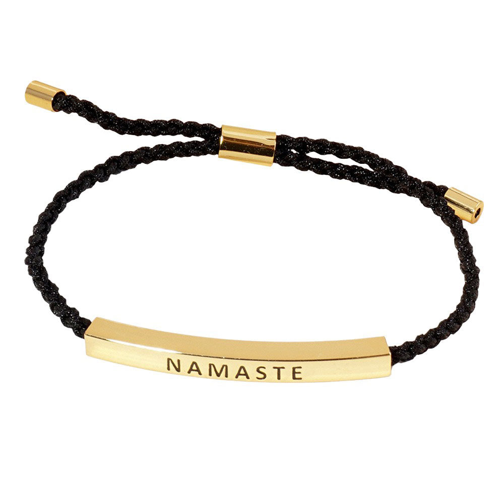 Gold-Dipped NAMASTE Message Bar Pointed Rope Bracelet is a versatile and stylish addition to any outfit. The dipped finish adds a touch of elegance, while the adjustable rope design allows for a perfect fit. Show off your spiritual side with the NAMASTE message bar, a reminder to always stay centered and at peace