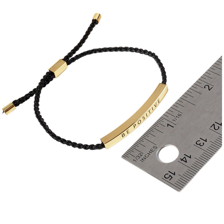 Gold-Dipped SISTERS Message Bar Pointed Rope Adjustable Bracelet is a perfect accessory for anyone looking to add a personal touch to their outfit. Featuring a sleek, adjustable design, it allows for a comfortable and customizable fit. With a special message bar, it adds a sentimental touch to any ensemble.