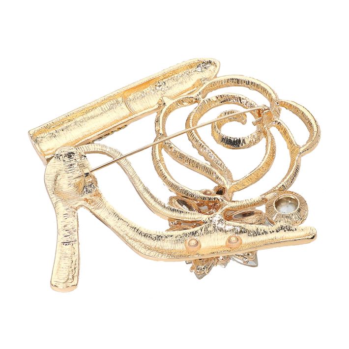 Glamorous brooch featuring a high heel, lipstick, floral accents, and sparkling crystals. A bold statement accessory perfect for adding flair to jackets, scarves, or bags. Ideal for special occasions or gifting with a touch of fashion-forward fun.