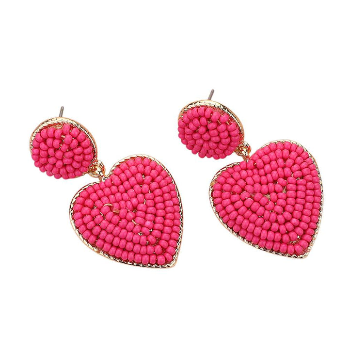 Gold-High-Pink-Seed Beaded Heart Dangle Earrings are handcrafted with intricate seed beads, adding a delicate and stylish touch to any outfit. The heart-shaped design adds a touch of romance, making them a perfect gift for your loved one. Expertly crafted with quality materials, these earrings are durable and long-lasting. 