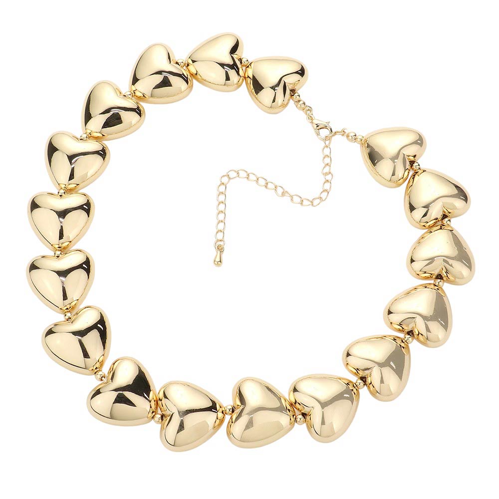 Gold Metal Heart Pebble Choker Necklace is a stunning piece that adds a touch of elegance to any outfit. Crafted with durable metal materials, this necklace features a beautiful heart-shaped pebble that symbolizes love and resilience. Its adjustable design ensures a comfortable fit for all. Elevate your style.