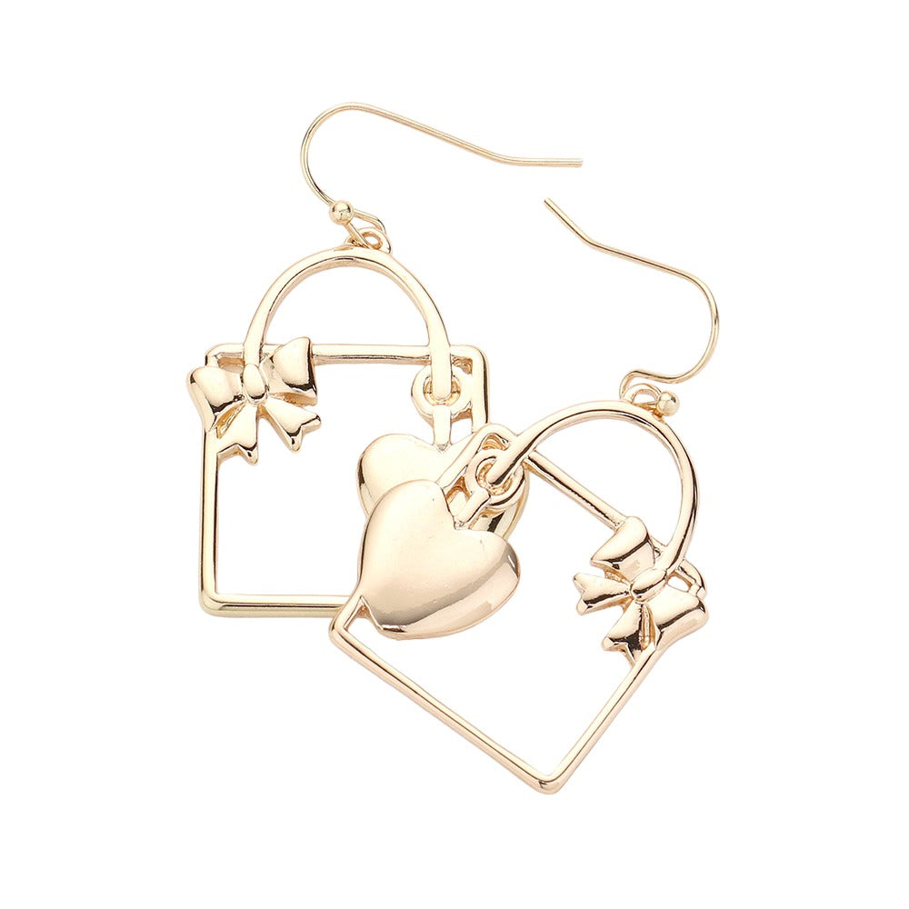 Unlock your heart (and style) with these quirky Gold Metal Heart Ribbon Lock Gift Box Dangle Earrings. Perfect for Valentine's Day, Dia del Amor (or any day!), these playful earrings will add a touch of fun to any outfit. Plus, the unique lock and key design is an ode to the power of love. Birthday Gift, Regalo Cumpleanos.
