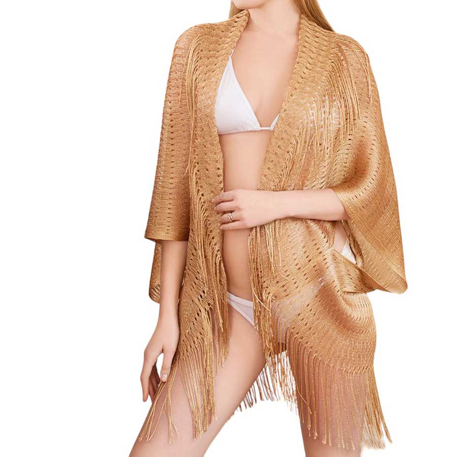 Gold Metallic Tassel Cover Up Kimono Poncho, Add some shimmer to your beach look with our cover up poncho. This stylish and playful cover up doubles as a kimono and poncho, perfect for any pool party or beach day. Stand out with the metallic detailing and have fun with the tassel accents.