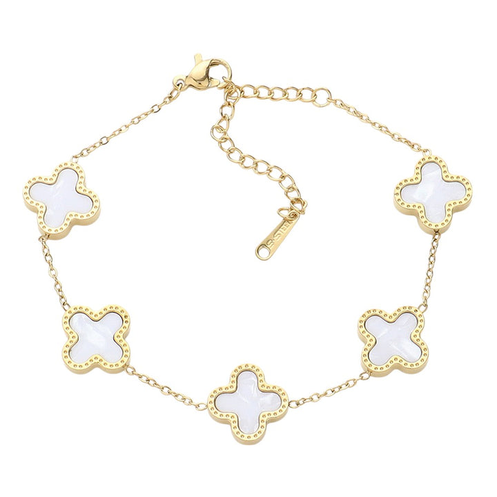 Gold Mother of Pearl Stainless Steel Quatrefoil Station Bracelet is both elegant and durable, making it the perfect accessory for any occasion. The mother-of-pearl accents add a touch of sophistication, while the stainless steel material ensures long-lasting wear. Showcase your style with this stunning bracelet.